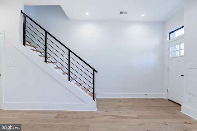 entryway with light hardwood / wood-style floors