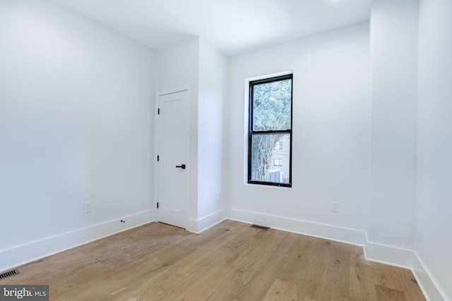 spare room featuring light hardwood / wood-style floors