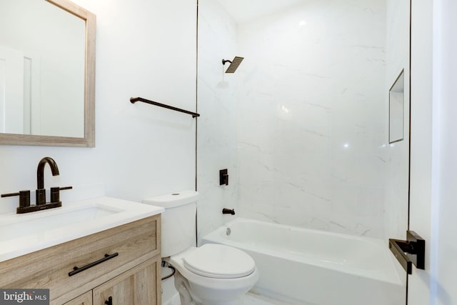 full bathroom featuring vanity, toilet, and tiled shower / bath