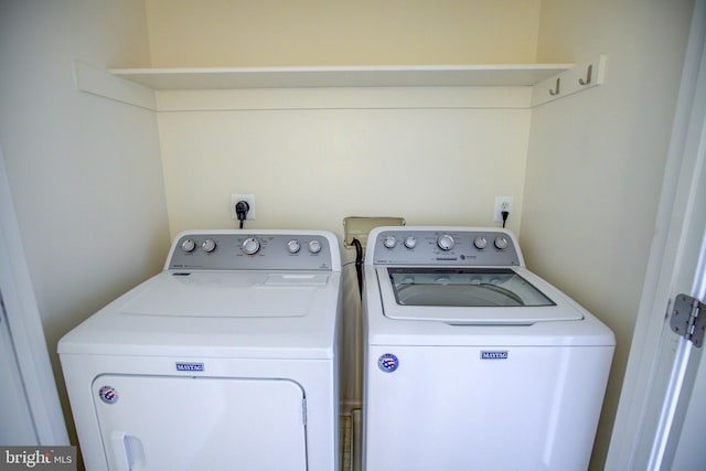 laundry room featuring washer and clothes dryer