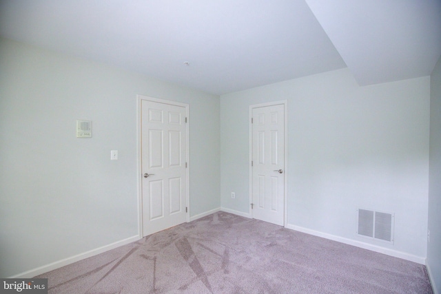 spare room featuring carpet floors