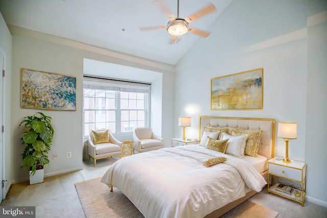 carpeted bedroom featuring ceiling fan and high vaulted ceiling