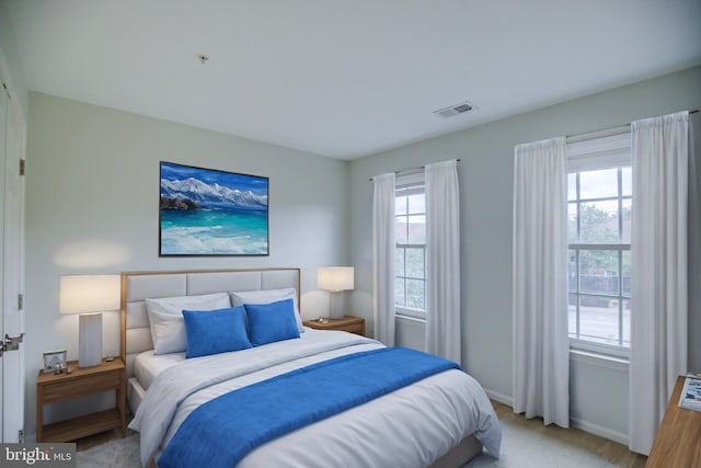 bedroom featuring light wood-type flooring