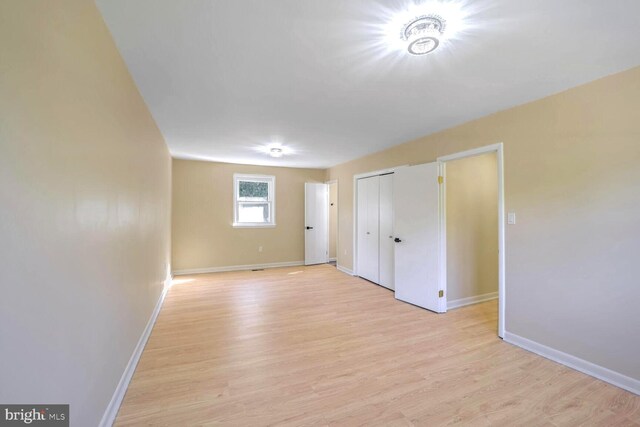 unfurnished room featuring light wood-type flooring