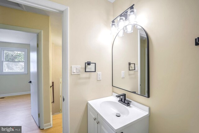 bathroom with vanity and hardwood / wood-style floors