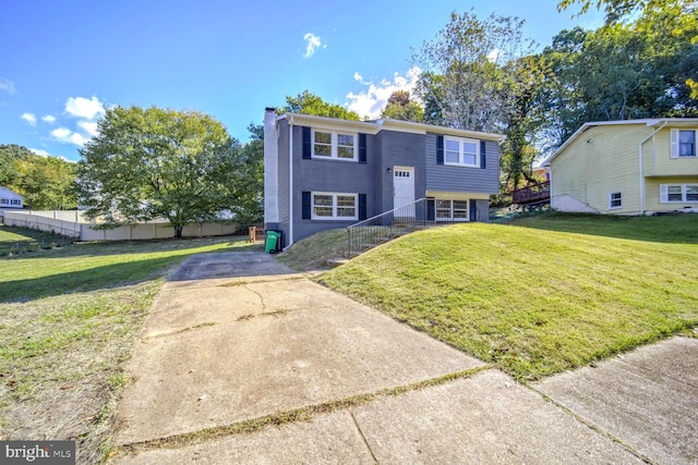 raised ranch featuring a front yard