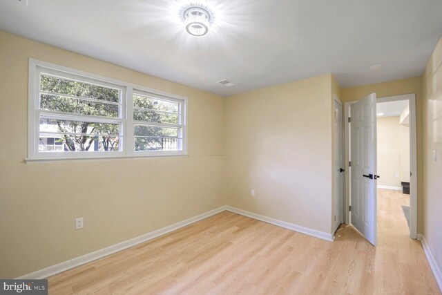 unfurnished bedroom featuring light wood-type flooring