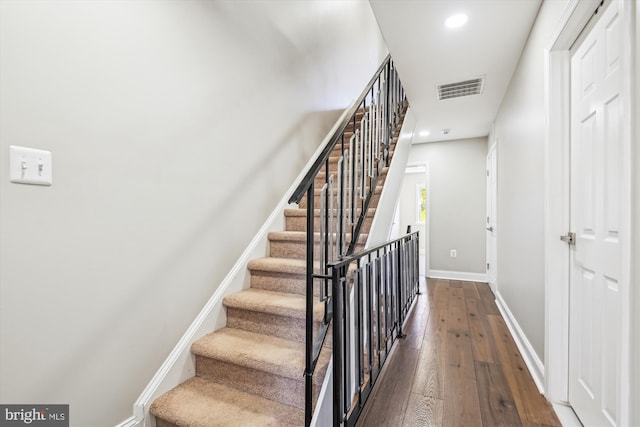 stairway with wood-type flooring