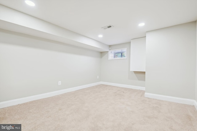 basement with light colored carpet