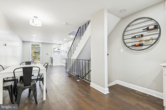 dining area featuring dark hardwood / wood-style floors