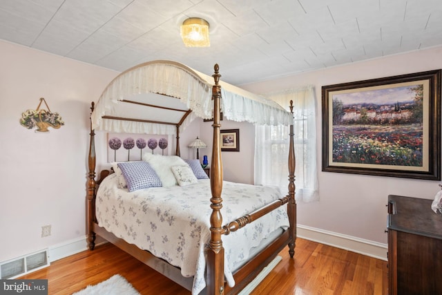 bedroom featuring hardwood / wood-style floors