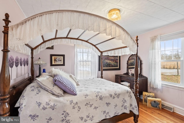 bedroom featuring hardwood / wood-style flooring