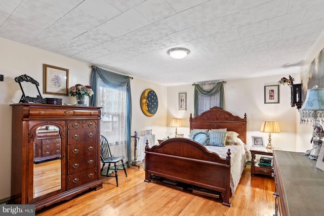 bedroom with light hardwood / wood-style floors