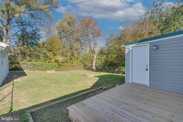 exterior space with a storage shed and a lawn