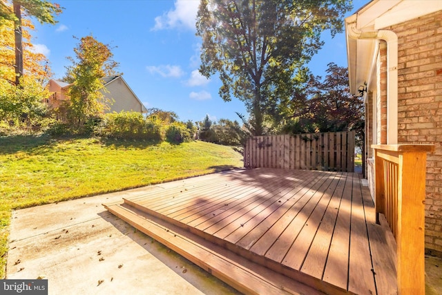 wooden deck with a lawn