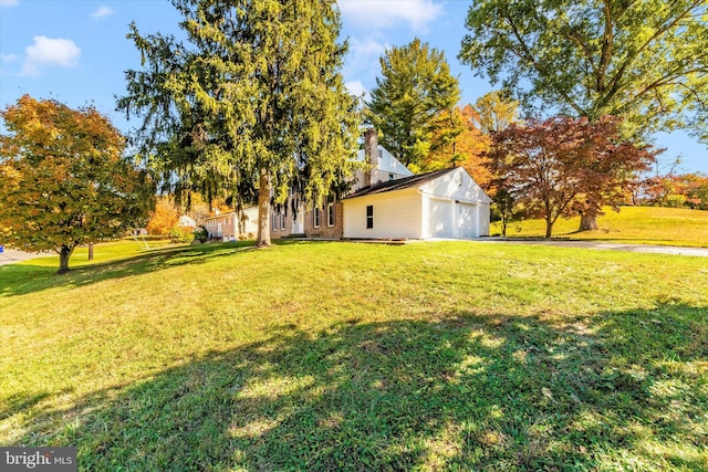 view of yard featuring a garage