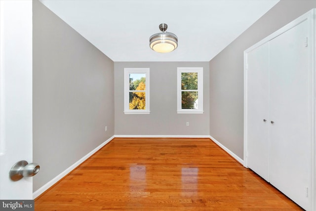 empty room with light wood-type flooring