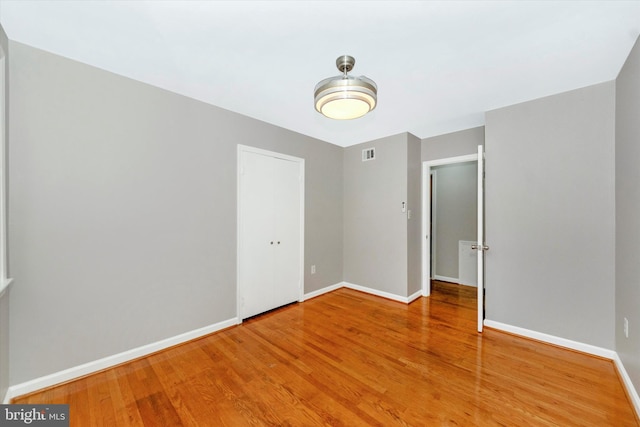 unfurnished room featuring wood-type flooring