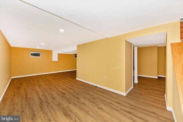 unfurnished room with hardwood / wood-style floors