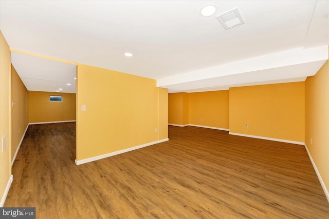 empty room with hardwood / wood-style flooring