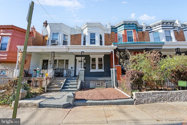 view of property featuring covered porch