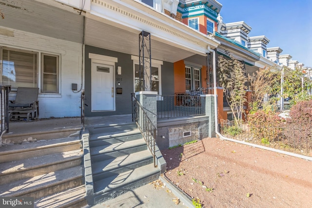 doorway to property with covered porch