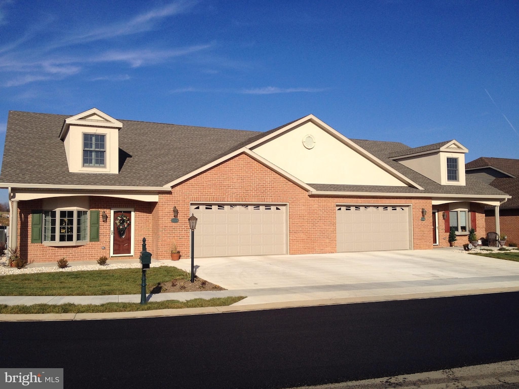 view of front of property with a garage