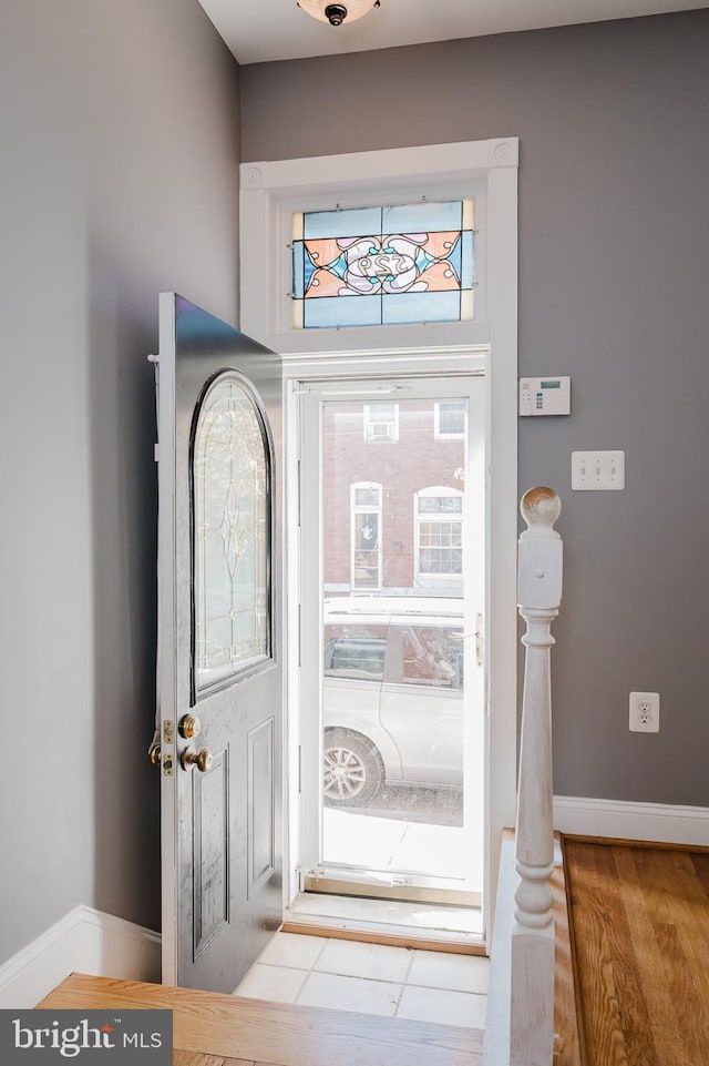 foyer entrance featuring a healthy amount of sunlight and hardwood / wood-style flooring