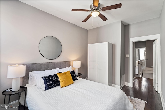 bedroom featuring ceiling fan and dark wood-type flooring