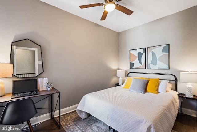 bedroom with dark hardwood / wood-style floors and ceiling fan