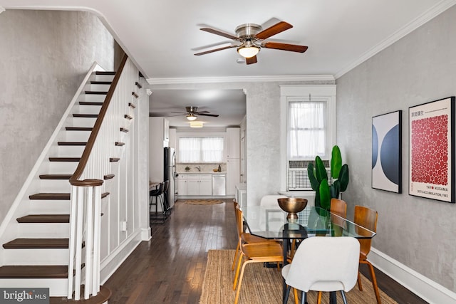 dining area with ceiling fan, dark hardwood / wood-style flooring, and ornamental molding