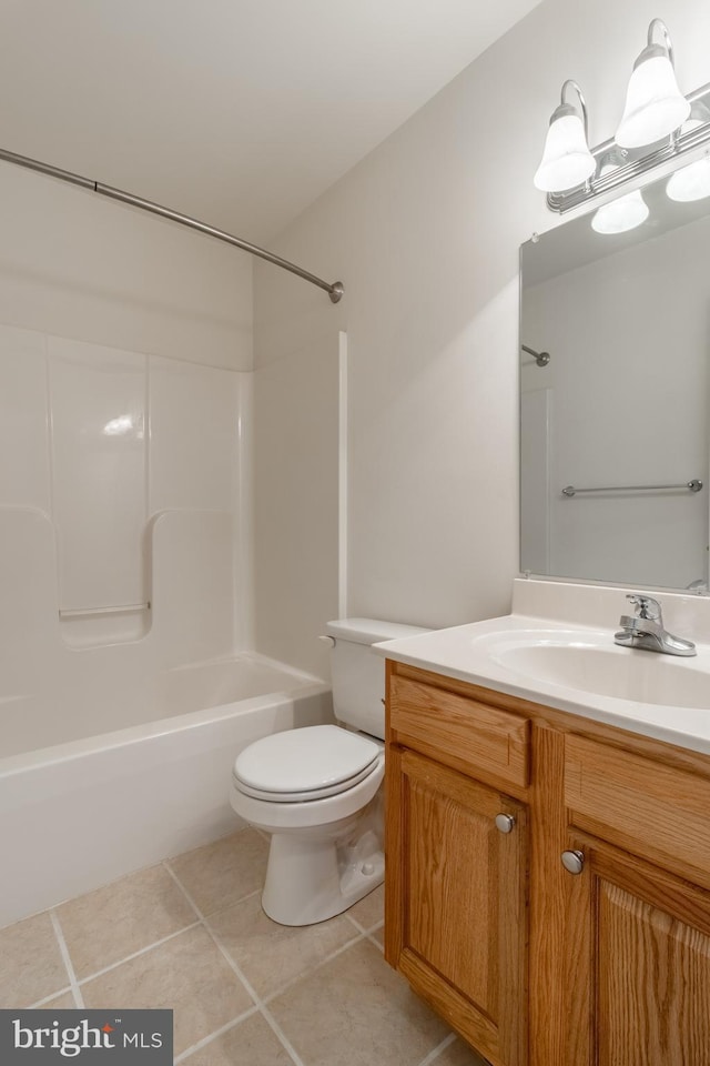 bathroom with vanity, shower / bathing tub combination, tile patterned flooring, and toilet