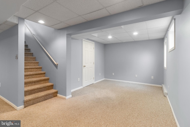 finished basement featuring stairs, carpet floors, recessed lighting, and baseboards