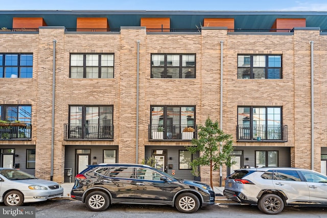 view of front of property with a balcony