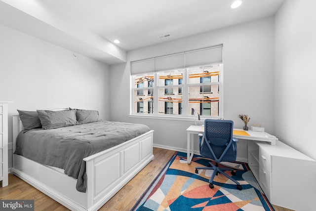 bedroom with light hardwood / wood-style floors