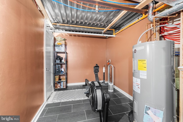 utility room featuring water heater