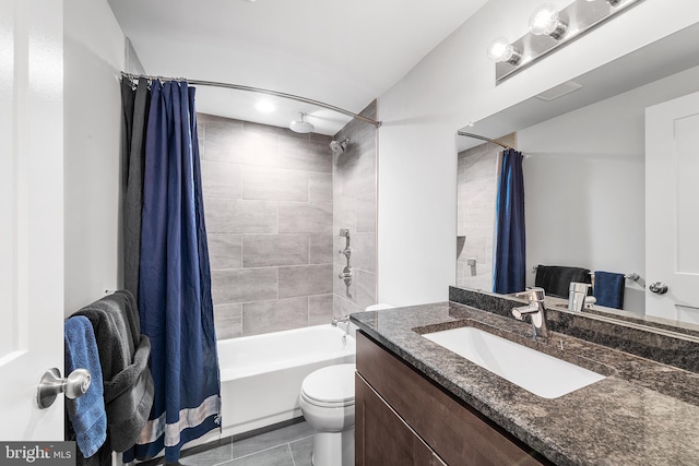 full bathroom with vanity, toilet, tile patterned floors, and shower / tub combo