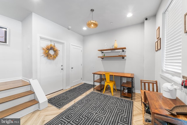 foyer featuring light parquet floors