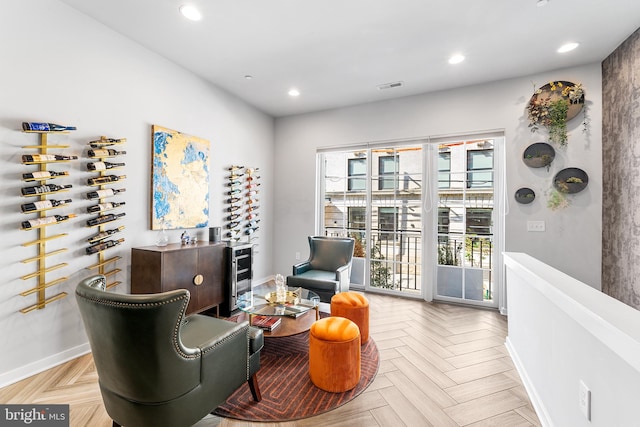 living area featuring light parquet flooring