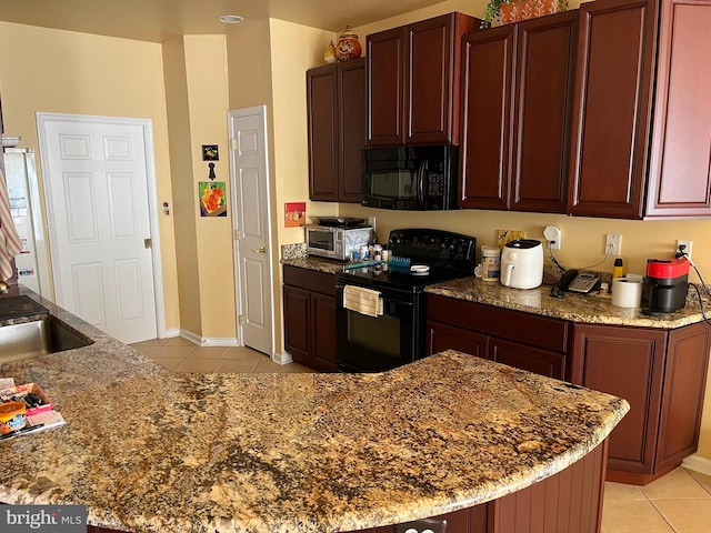 kitchen featuring stone counters, light tile patterned floors, black appliances, and sink