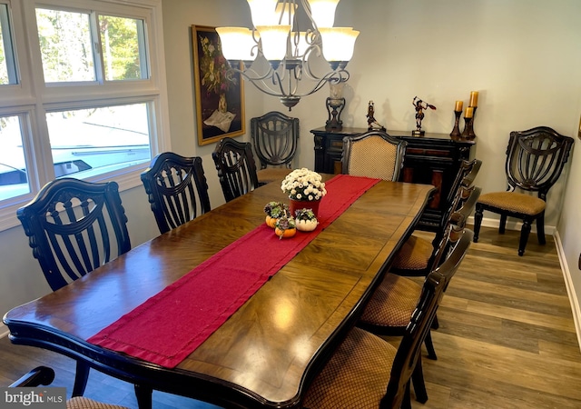 dining room featuring a notable chandelier and hardwood / wood-style floors