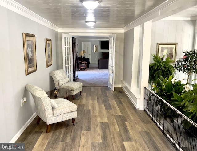 hall featuring french doors, hardwood / wood-style floors, and crown molding