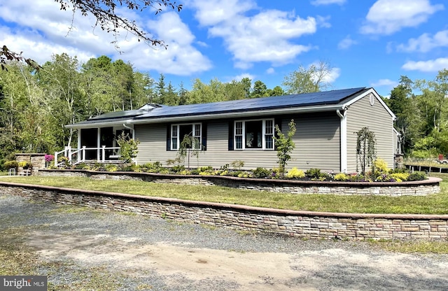 view of front of home with solar panels