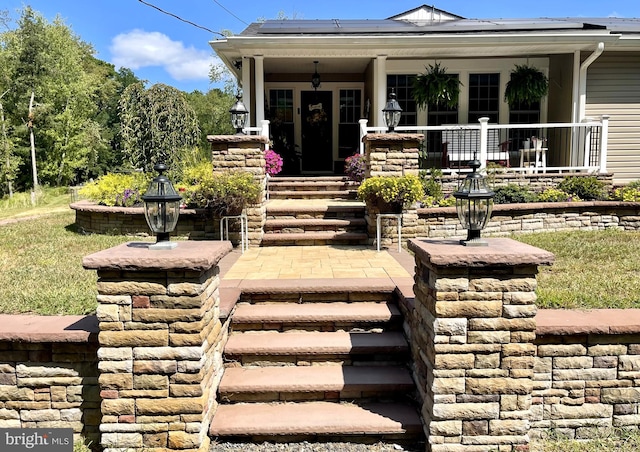 rear view of property with a porch