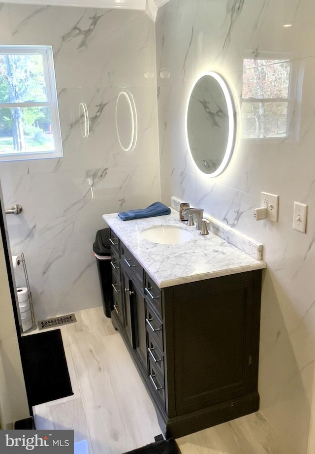 bathroom with vanity and hardwood / wood-style floors