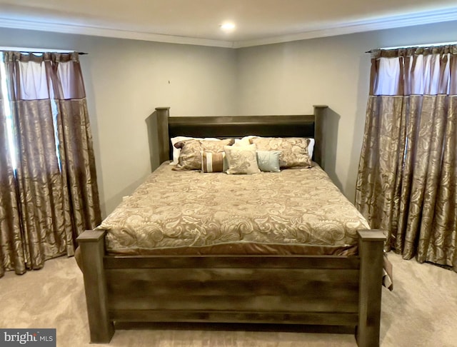 carpeted bedroom with crown molding