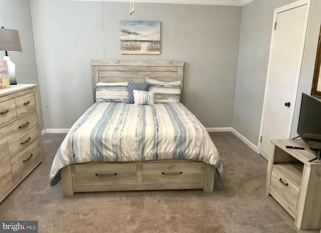 carpeted bedroom featuring ornamental molding