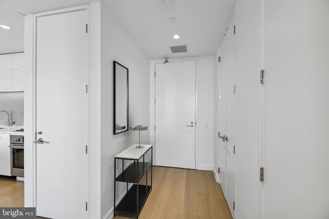 hall featuring light hardwood / wood-style floors