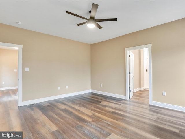 spare room featuring ceiling fan and wood-type flooring