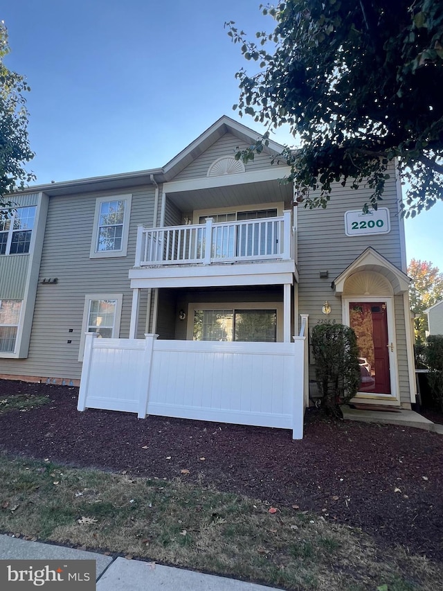 view of front of house with a balcony